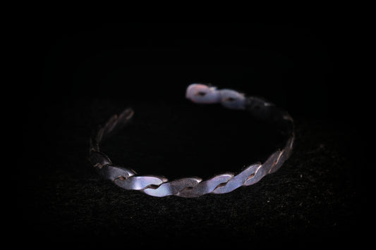 Silver bracelet on a black background